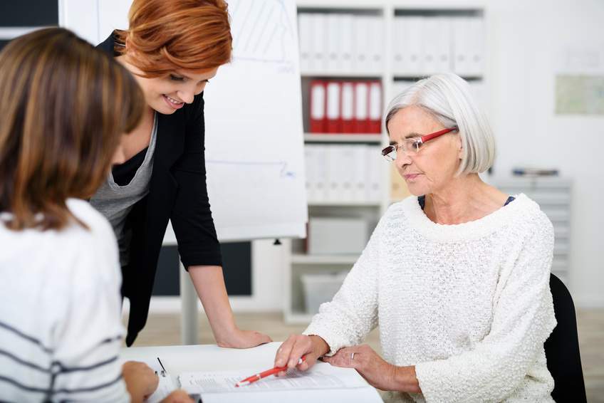 Senior citizen talks to her daughters about business succession